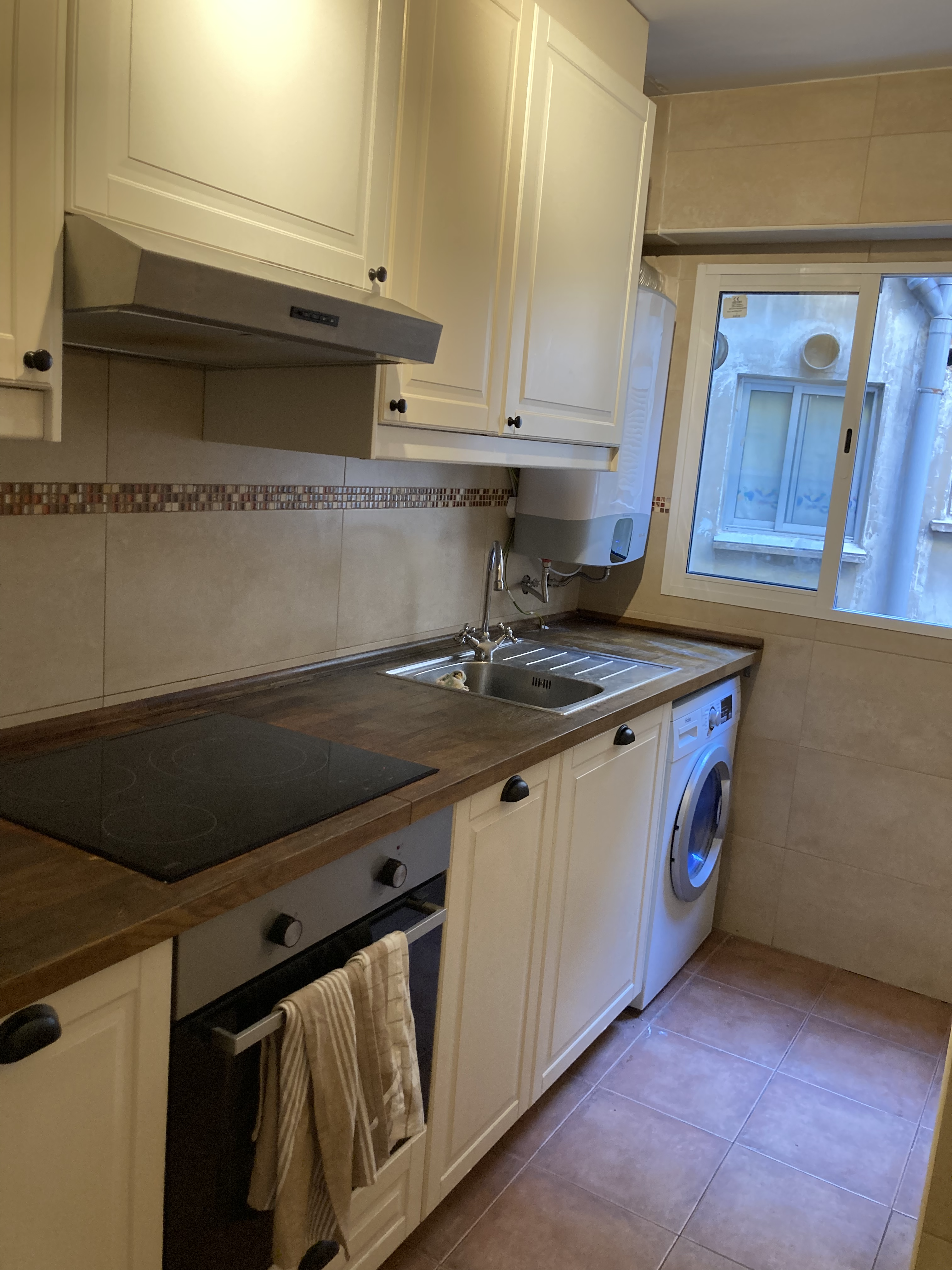 Kitchen - washing machine, stove and oven